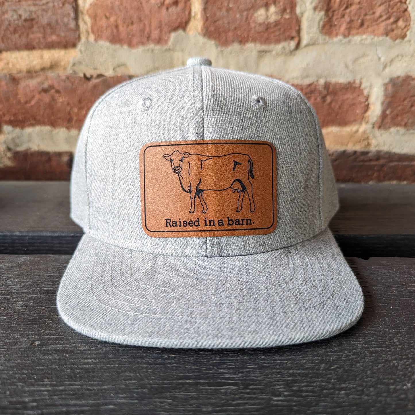 Grey "Raised in a barn" Trucker Hat