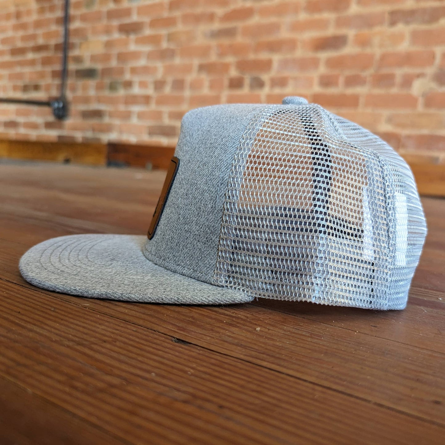 Grey "Raised in a barn" Trucker Hat